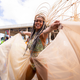 Former Project Runway winner Anya Ayoung-Chee crosses the Savannah stage in the section Bamboo of The Lost Tribe. Photo Credit: Mark Gellineau